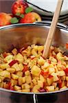Chopped nectarines in a pot to make a delicious jam