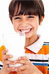 Young kid with glass of milk isoalted on white background