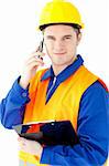 Smiling worker holding a clipboard talking on phone looking at the camera against white background