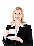 Charismatic businesswoman holding a cup of coffee agaisnt white background