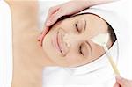 Beautiful restign woman receiving a beauty treatment in a spa center