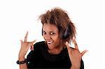 beautiful black woman listening music in headphones, isolated on white background, studio shot
