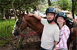 Equestrian couple posing on a horse ranch in Costa Rica