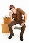Mover or delivery man sits down to rest on a busy day.  Full body on white background.