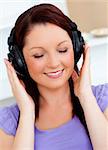 Blissful woman listen to music at home