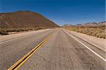 Highway through brown hills near Inyokern, California