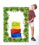 Boy holding a christmas banner isolated on white background