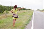 women tourist stand up on the road border