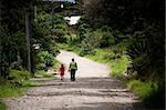 Woman and child walking in scenic Costa Rica