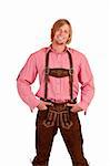 Happy casual Bavarian man with oktoberfest leather trousers (lederhose) . Isolated on white background.