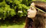 young pierced woman on green background, selective focus on eye