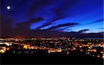 View on Edinburgh city and harbor in night from nationl Monument, Scotland