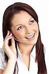 Charming young businesswoman wearing earpiece against a white background