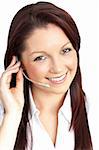 Smiling young businesswoman wearing headphones against a white background
