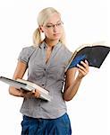 very pretty teacher in casual dress wearing glasses and reading on a book