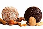 traditional german lebkuchen setup with hazelnuts cinnamon sticks and star anise on white background