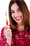 potrait of young lady posing with toothbrush