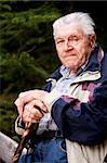 A portrait of an elderly man sitting looking at the camera