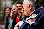 An elderly man telling stories