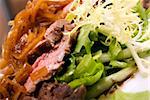 Meat served with salad and onion