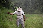 Costa Rican ranch hand with a machete