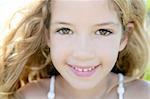 beautiful little girl portrait smiling closeup face looking camera