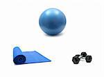 An exercise mat, fitball and hand weights isolated against a white background