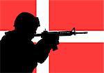Silhouette of a Danish soldier with the flag of Denmark in the background