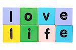 toy letters that spell love life against a white background with clipping path