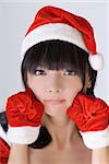 Sweet Christmas girl of Asian, closeup portrait.