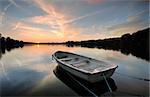 sunset at the lake a quiet evening with calm water