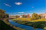 The river flows near to old factory