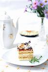 Chocolate dessert with tea, violet flowers and napkin