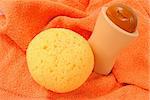 Bath items for shower on the orange towel