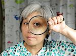 woman holding magnifier