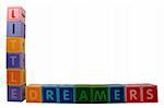 toy letters that spell little dreamers against a white background with clipping path