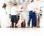 People in blurred motion entering subway station