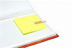 Note pad with plaid paper, yellow bookmark and rose staple
