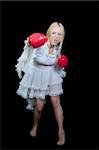 A beautiful young woman wearing a pair of boxing gloves