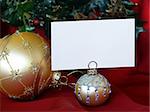 Christmas greeting card with gold balls on red