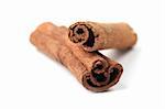 Close-up of cinnamon sticks isolated on white background. Shallow dof