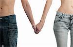 man and woman in jeans, hand in hand, isolated on white background