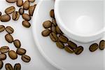empty cup of coffee with coffee beans