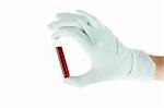 Doctor's hand in glove with blood test isolated on white