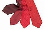 Four male ties, red and crimson on white background