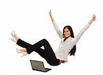Young businesswoman with laptop with her hands up