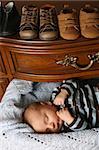 Month old baby boy sleeping in a drawer