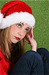 Teenager with red lips wearing a christmas hat