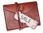 Vintage Sale Tag on an Old Leather Journal Isolated on White with a Clipping Path.