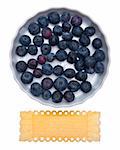 Fresh Bowl of Blueberries with Vintage Grunge Label Isolated on White with a Clipping Path.